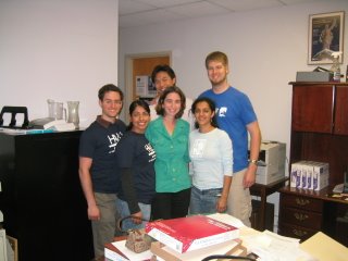 HALO members posing with host in her office