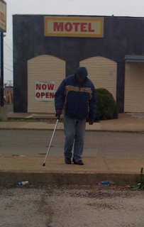 Homeless man crossing street