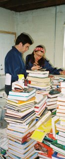 Local volunteers examining pile of school books