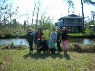 HALO members in front of house being built